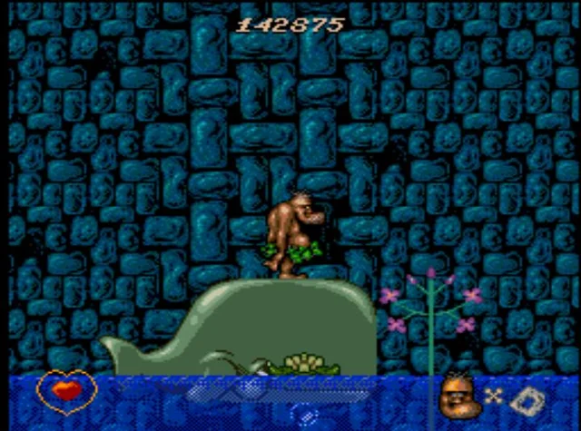 Gameplay del juego retro Chuck Rock, videojuego clásico de plataformas con cavernícola sobre un dinosaurio en una cueva, arcade retro incluido en consolas Pandora’s Box